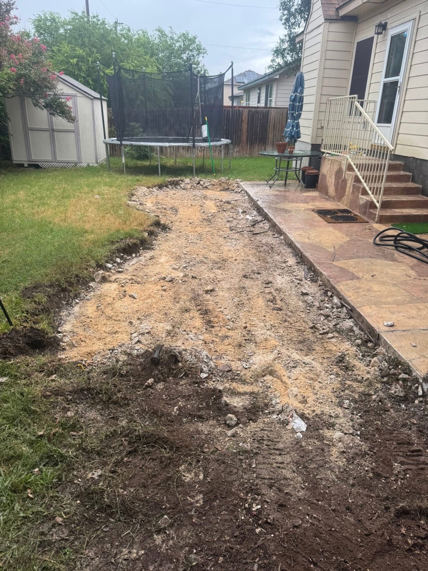 Backyard concrete demo and haul-off cleanup in a San Antonio yard